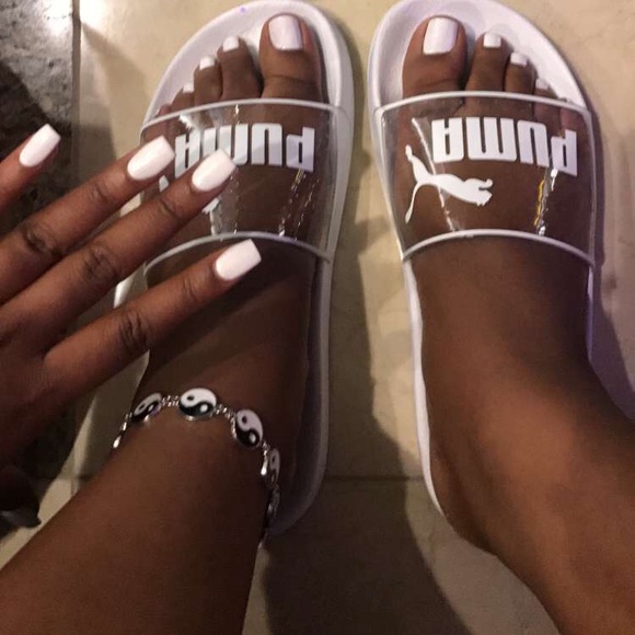 clear and white puma slides